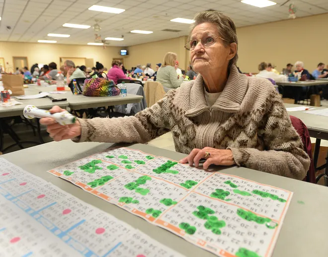 Wanda Suscheck, 74, of Harbor Creek Township, plays bingo at the Belle Valley Fire Department on Jan. 4. JACK HANRAHAN/
