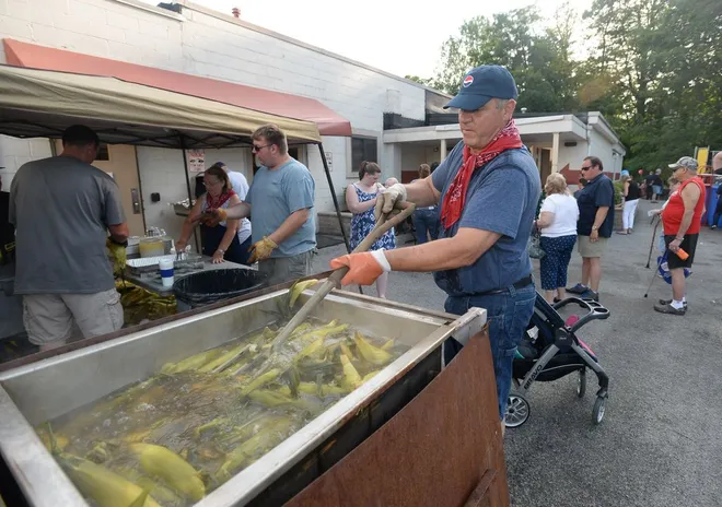 Joe Kujawa of Millcreek Township roasts corn during the National Night Out event Aug. 1, 2017, at the Belle Valley Fire Department in Millcreek Township. [JACK HANRAHAN/ERIE TIMES-NEWS]