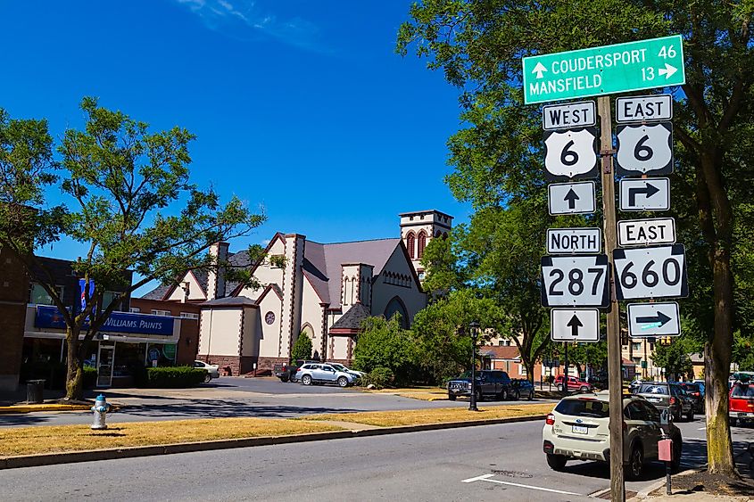 Directional route signs on Main Street in Wellsboro, Tioga County, Pennsylvania.