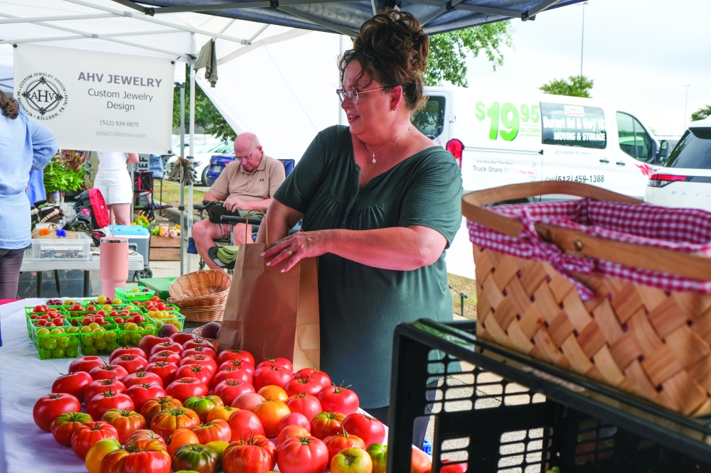 Lakeline Farmers Market is home to over 30 vendors each Saturday, selling seasonal produce, jams and more. (Katlynn Fox/Community Impact)