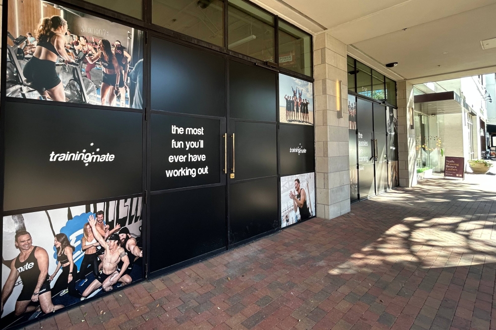Exterior of a store featuring Training Mate window signage.