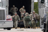 Military personnel in uniform, with the Texas National Guard patch on, are seen at the U.S....