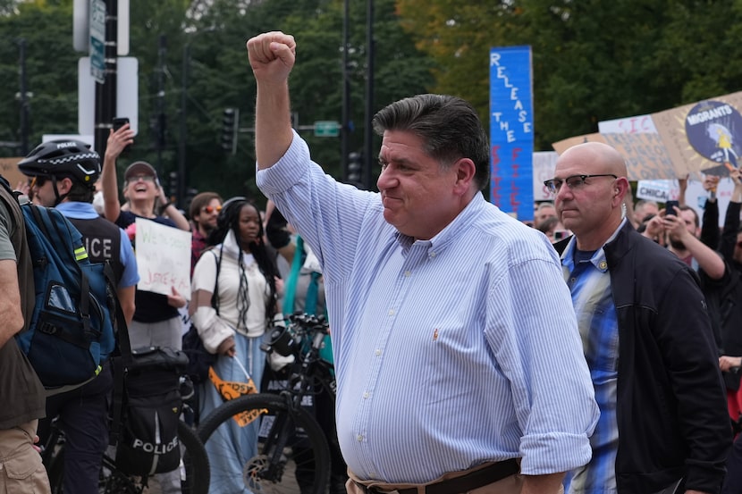 Illinois Gov. JB Pritzker arrives at a "No Kings" protest Saturday, Oct. 18, 2025, in...