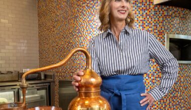Amy Tigner stands with a copper still used to make chocolate and a traditional chocolate pot" style=" height:1020px; width:1620px" _languageinserted="true" src="https://cdn.prod.web.uta.edu/-/media/project/website/news/releases/2025/10/tigner.jpg