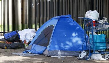 A homeless person sits inside a tent in Austin, Texas, USA, 22 April 2024