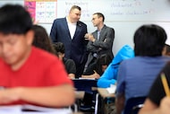 Education Commissioner Mike Morath (right) visits with State Board of Education District 11...