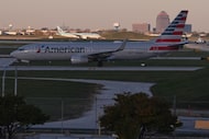 An American Airlines plane moves to a terminal at O'Hare International Airport in Chicago,...