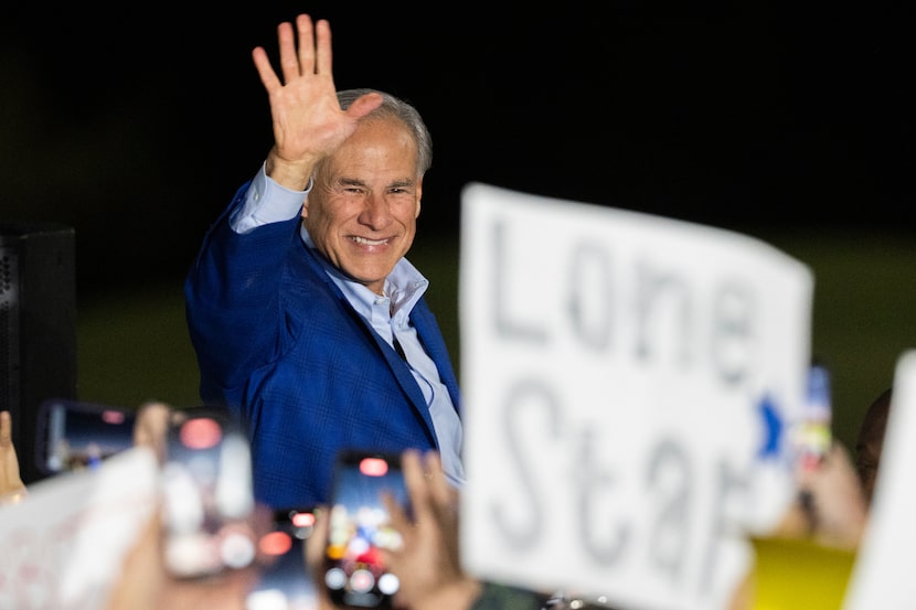 Gov. Greg Abbott waves to supporters as he announces his reelection campaign for Texas...