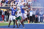 SMU running back T.J. Harden scores the game-winning touchdown during overtime of a college...