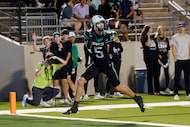 Southlake Carroll's Blake Gunter (5) secures a pass in the end zone for a touchdown in the...