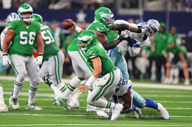 Philadelphia Eagles quarterback Jalen Hurts is sacked by Dallas Cowboys defensive tackle Osa Odighizuwa during the second half Sunday, Nov. 23, 2025, in Arlington, Texas. LM Otero/AP