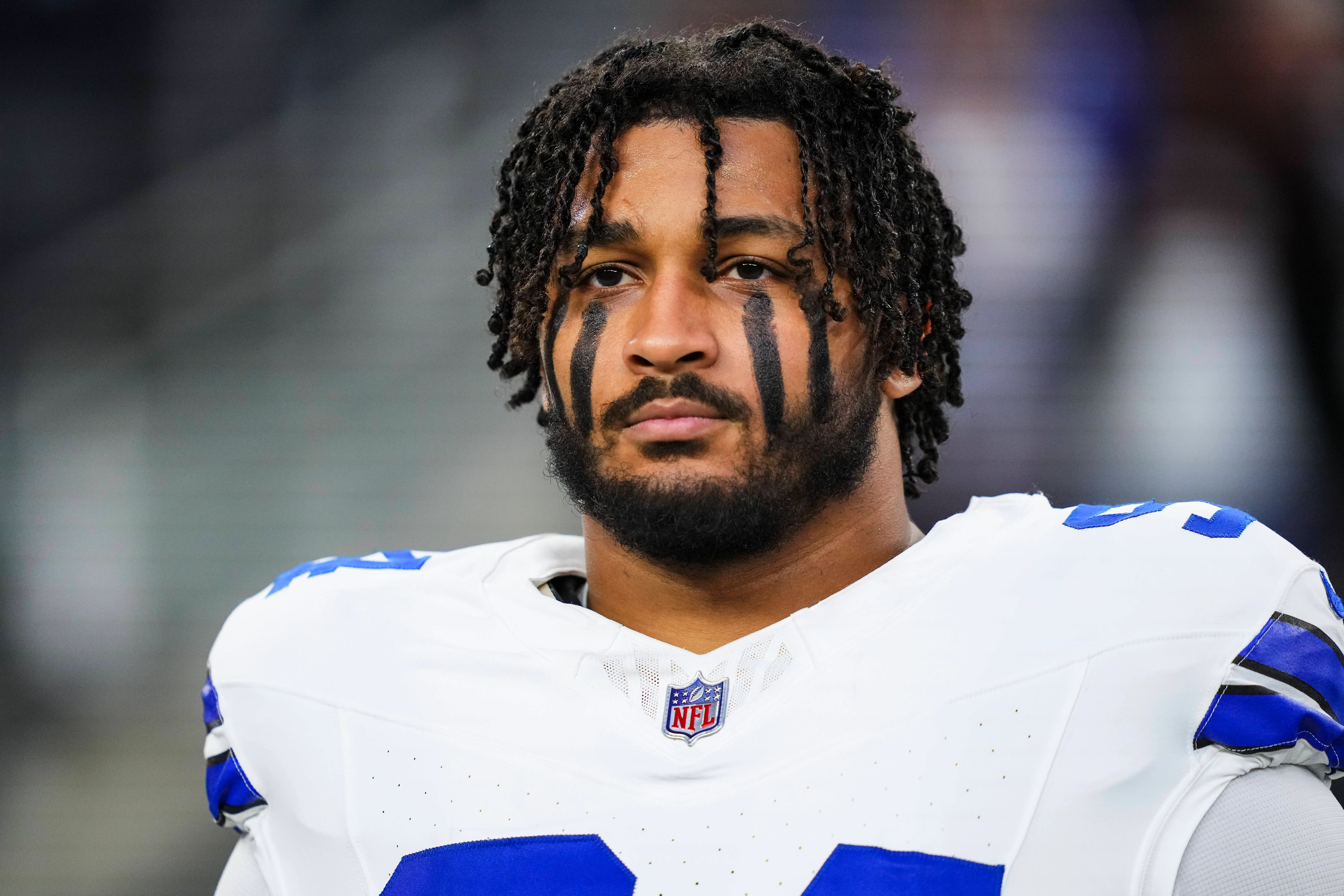 ARLINGTON, TX - DECEMBER 22: Marshawn Kneeland #94 of the Dallas Cowboys looks on from the sideline during the national anthem prior to an NFL football game against the Tampa Bay Buccaneers at AT&T Stadium on December 22, 2024 in Arlington, Texas. (Photo by Cooper Neill/Getty Images)