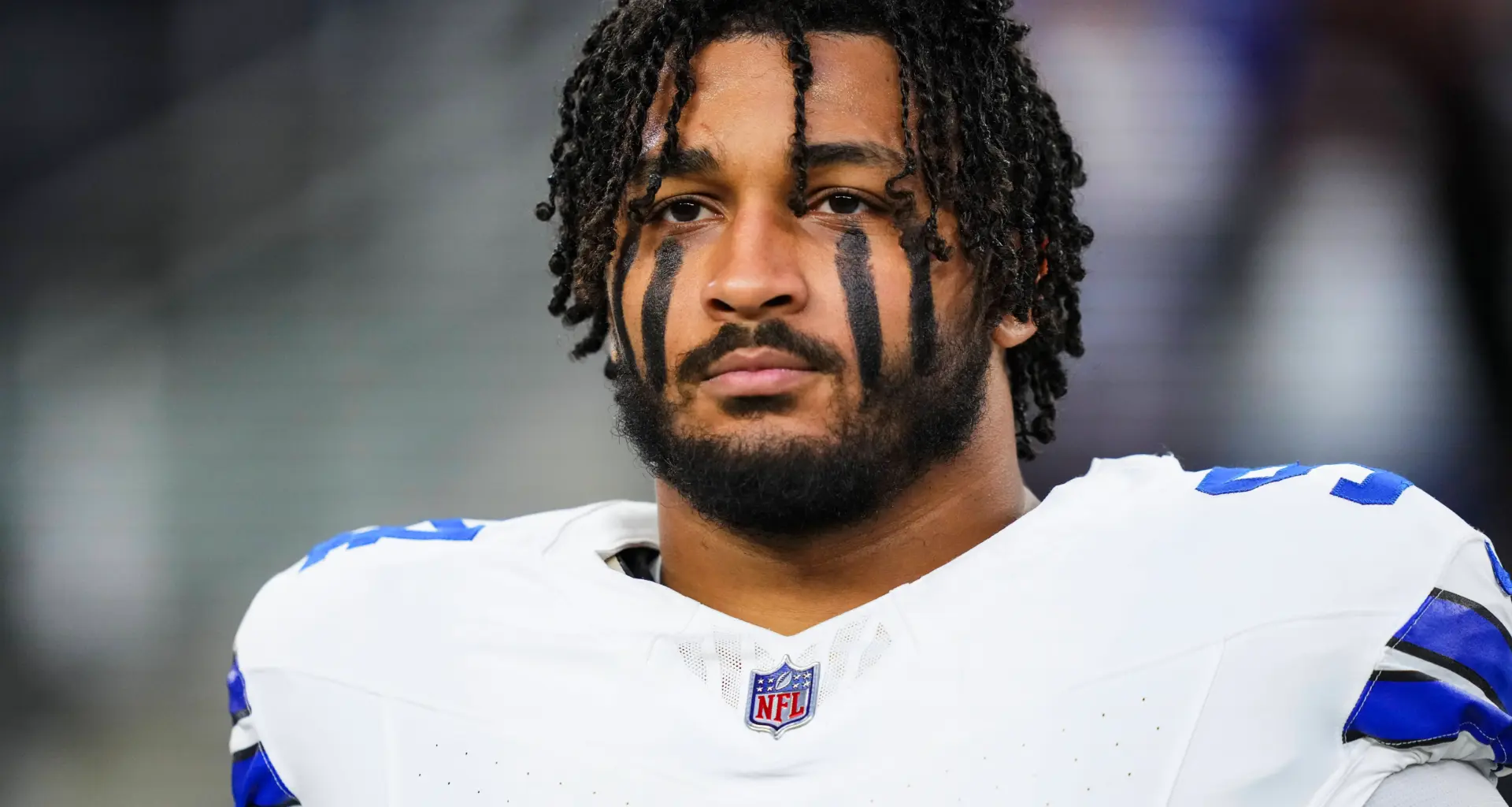 ARLINGTON, TX - DECEMBER 22: Marshawn Kneeland #94 of the Dallas Cowboys looks on from the sideline during the national anthem prior to an NFL football game against the Tampa Bay Buccaneers at AT&amp;T Stadium on December 22, 2024 in Arlington, Texas. (Photo by Cooper Neill/Getty Images)
