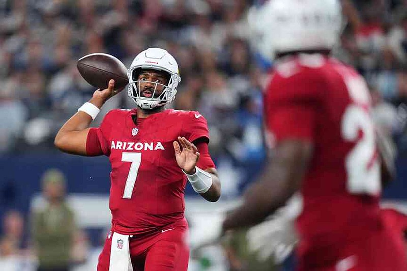 Arizona Cardinals quarterback Jacoby Brissett (7) throws a pass in the first half of an NFL football game against the Dallas Cowboys Monday, Nov. 3, 2025, in Arlington, Texas. (AP Photo/Julio Cortez)