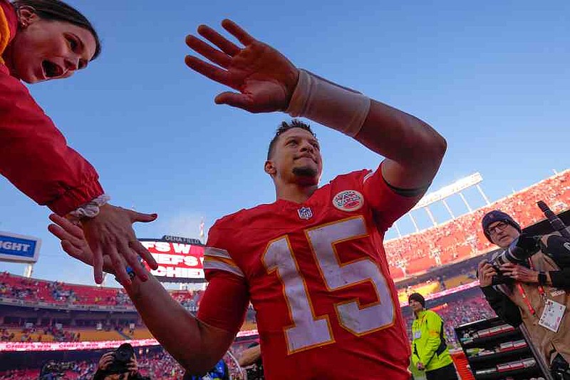 Kansas City Chiefs quarterback Patrick Mahomes (15) greets fans as he leaves the field following an NFL football game against the Indianapolis Colts Sunday, Nov. 23, 2025, in Kansas City, Mo. (AP Photo/Charlie Riedel)