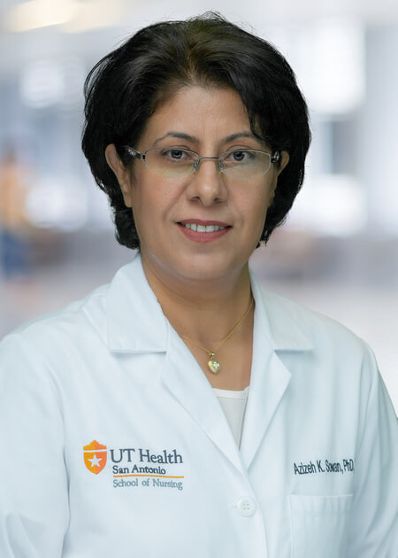 Dr. Sowan in her UT Health San Antonio white coat.