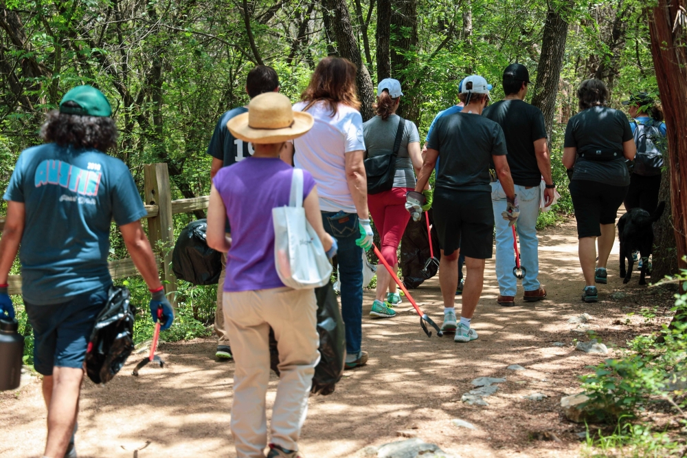 Hill Country Conservancy volunteers cleaning up Violet Crown Trail