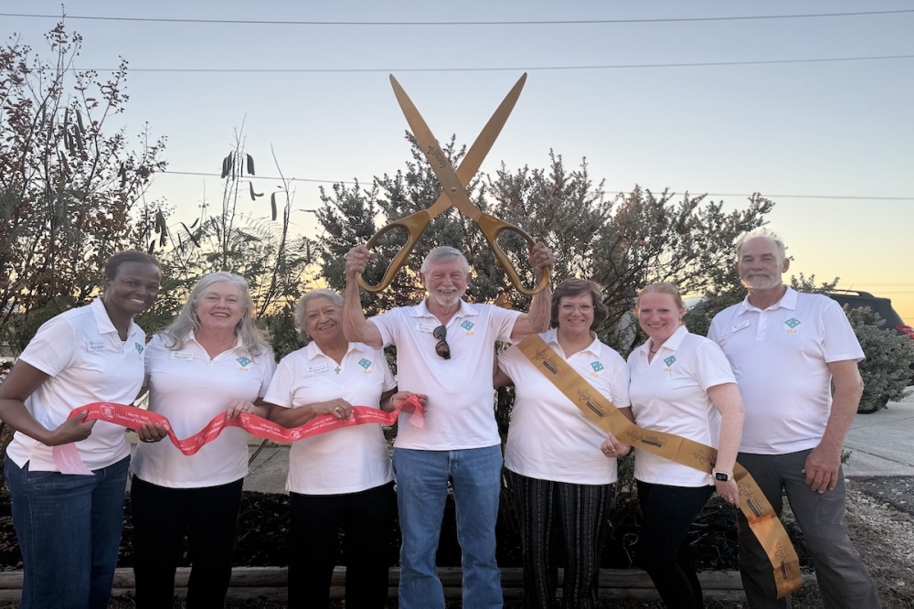 Community members and Operation Liberty Hill leadership came out for a commemorative ribbon-cutting to celebrate the nonprofit's 10th anniversary Nov. 5 (Melissa Romero/Community Impact)