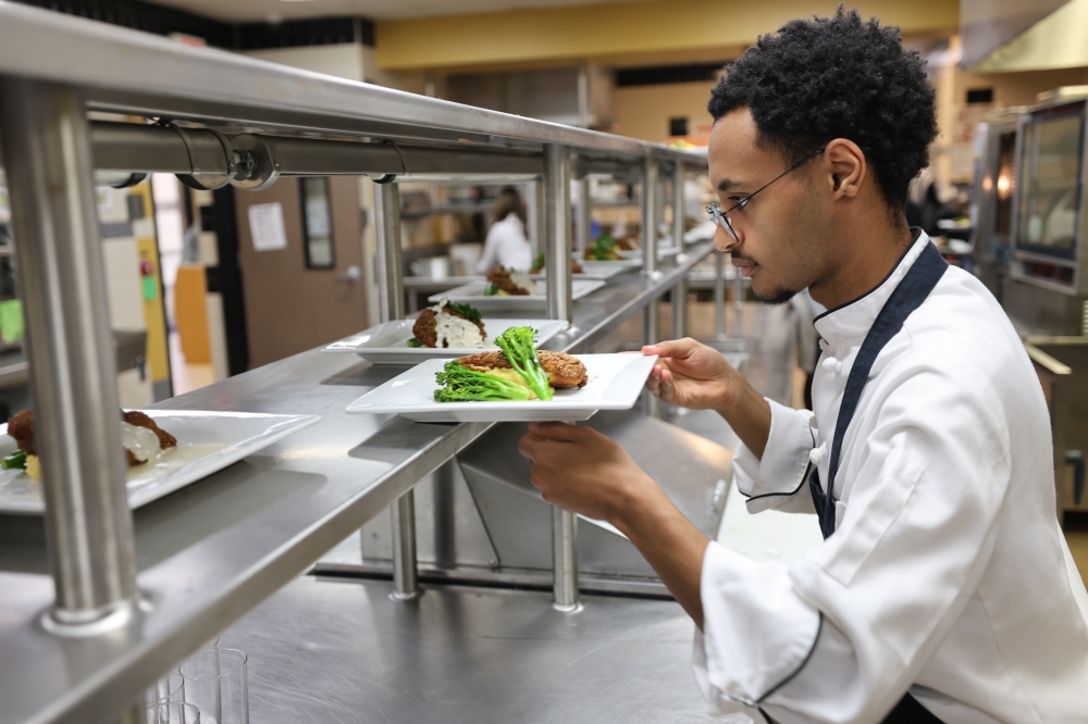 Plano ISD culinary CTE program student presents food