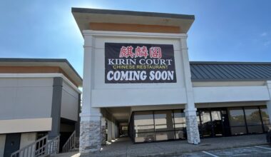 Exterior of strip mall featuring Kirin Court temporary signage.