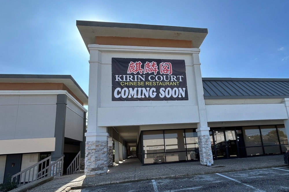 Exterior of strip mall featuring Kirin Court temporary signage.
