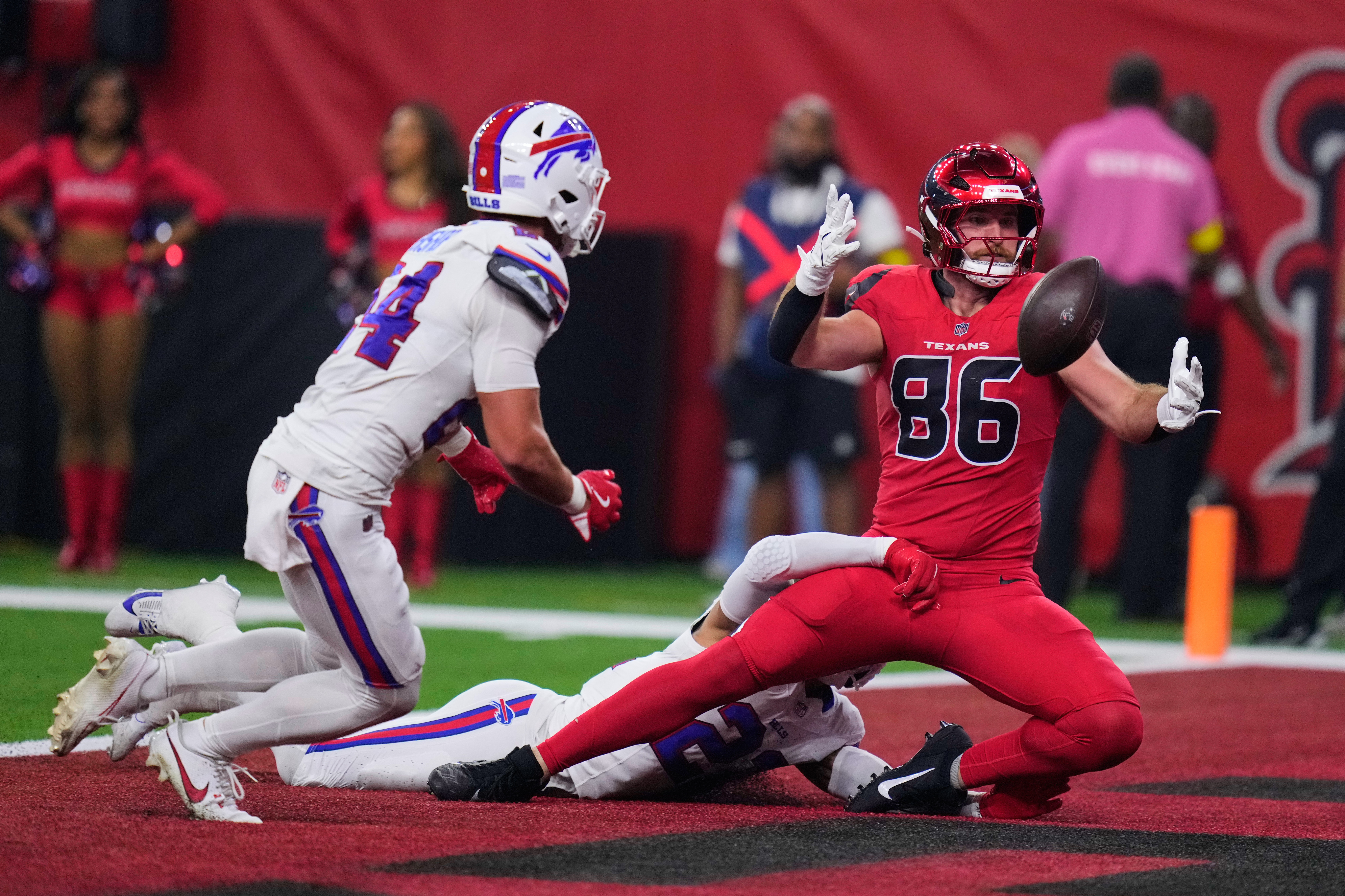Houston Texans tight end Dalton Schultz (86) is unable to catch a pass in the end zone as Buffalo Bills' Jordan Poyer, bottom, defends in the first half of an NFL football game Thursday, Nov. 20, 2025, in Houston. (AP Photo/Eric Christian Smith)