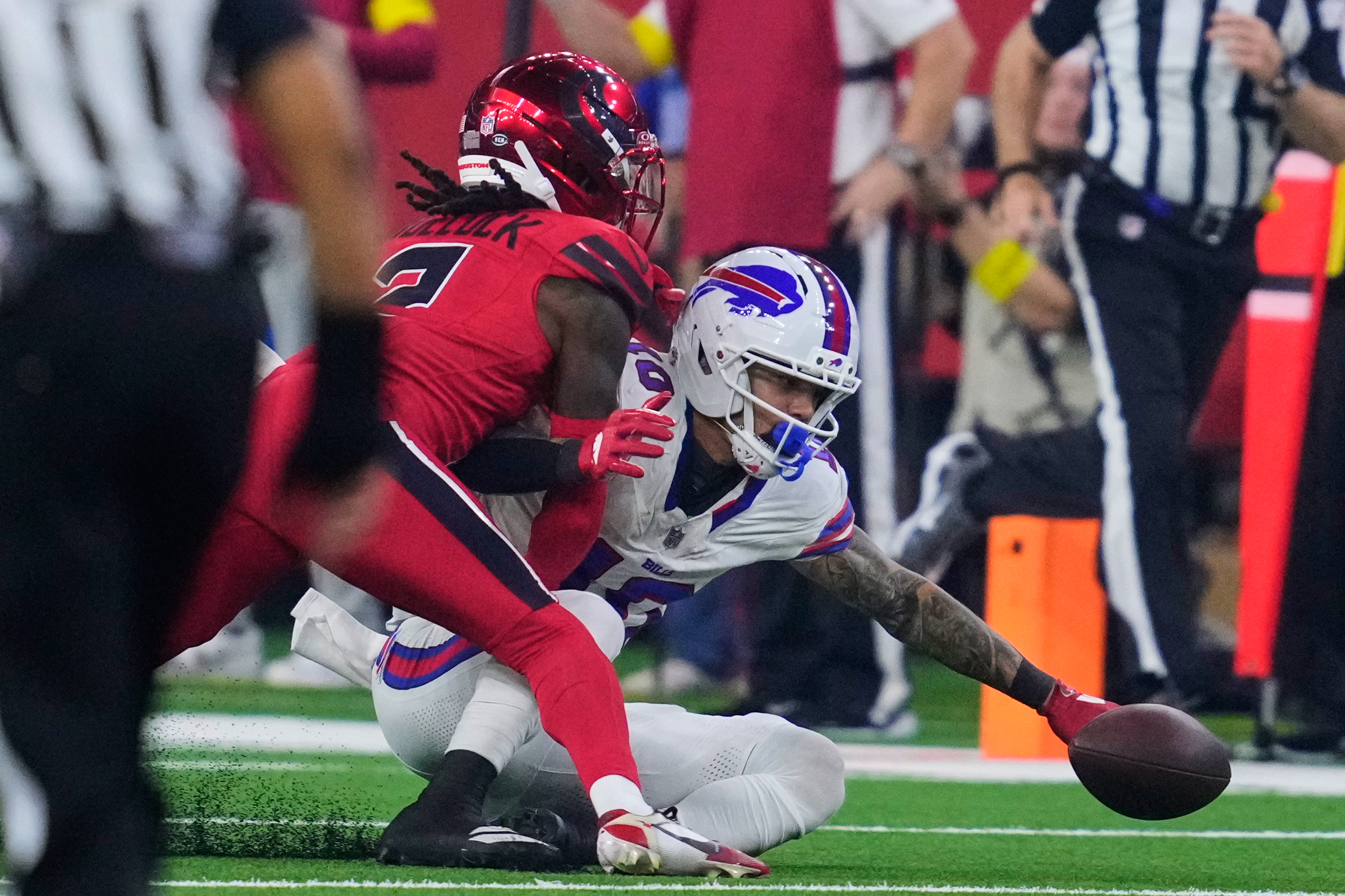 Buffalo Bills wide receiver Khalil Shakir (10) fumbles the ball after being hit by Houston Texans' Calen Bullock (2) in the second half of an NFL football game Thursday, Nov. 20, 2025, in Houston. (AP Photo/Ashley Landis)