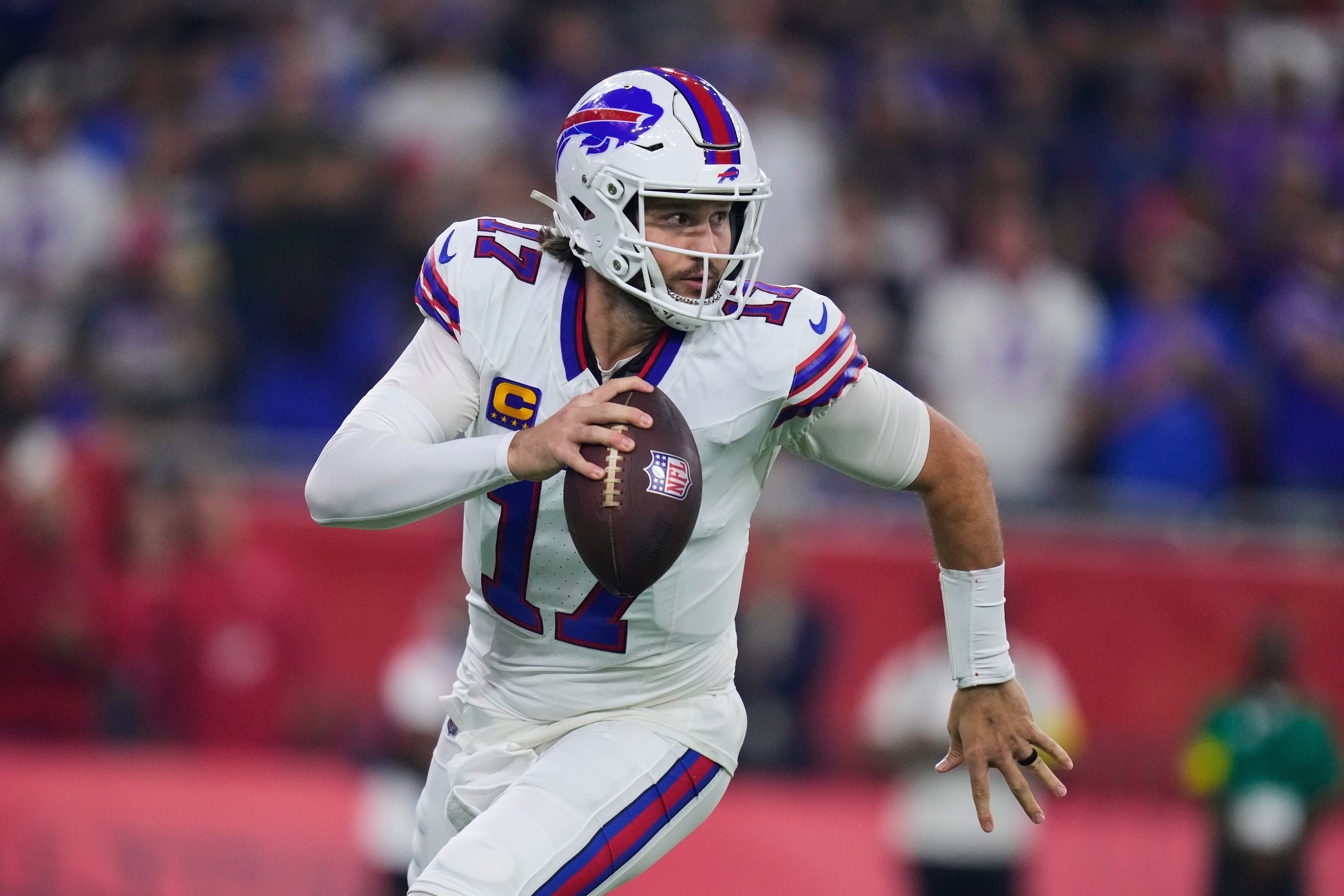 Buffalo Bills quarterback Josh Allen scrambles out of the pocket in the first half of an NFL football game against the Houston Texans Thursday, Nov. 20, 2025, in Houston. (AP Photo/Eric Christian Smith)