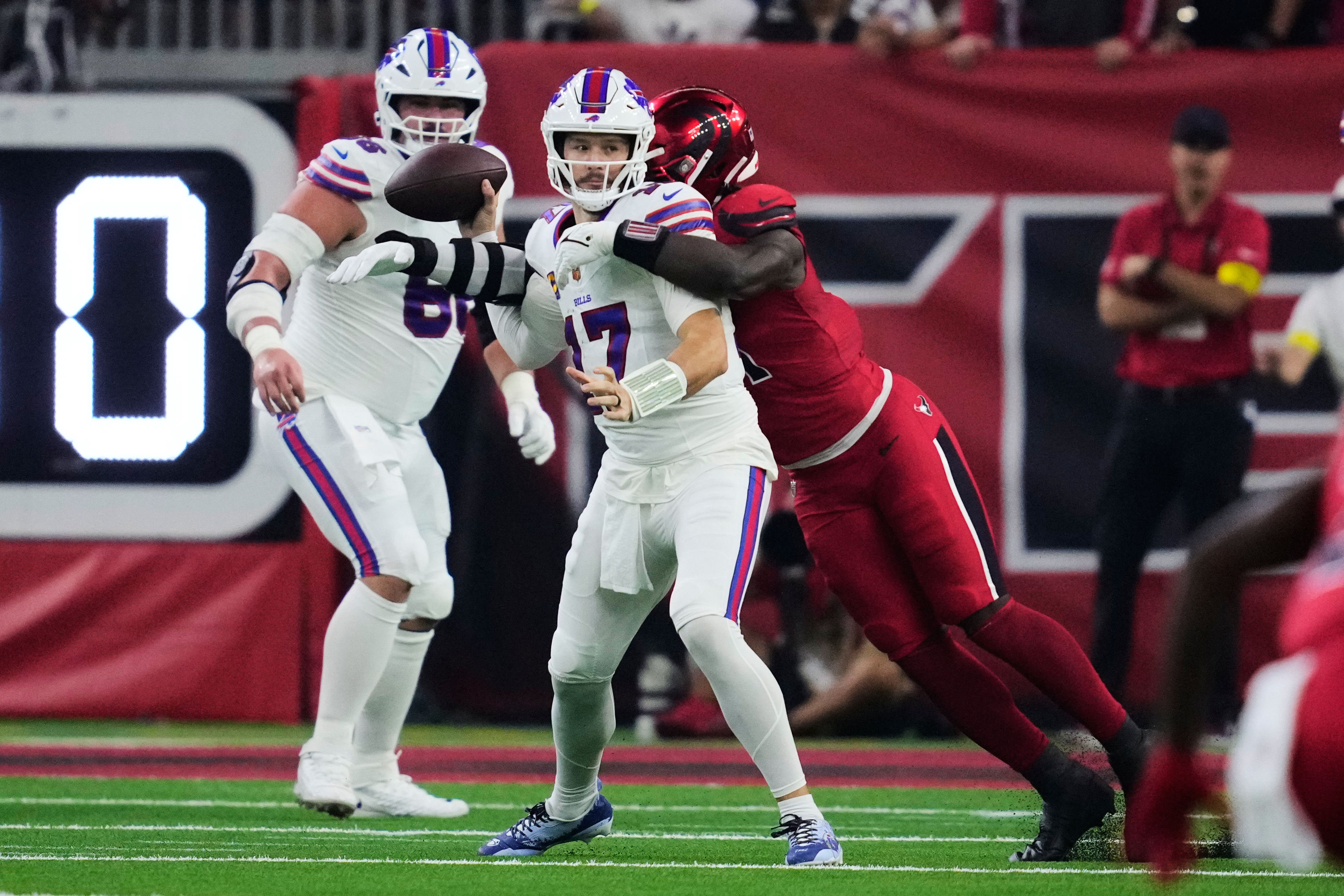Buffalo Bills quarterback Josh Allen (17) is sacked by Houston Texans defensive end Will Anderson Jr. (51) in the first half of an NFL football game Thursday, Nov. 20, 2025, in Houston. (AP Photo/Ashley Landis)