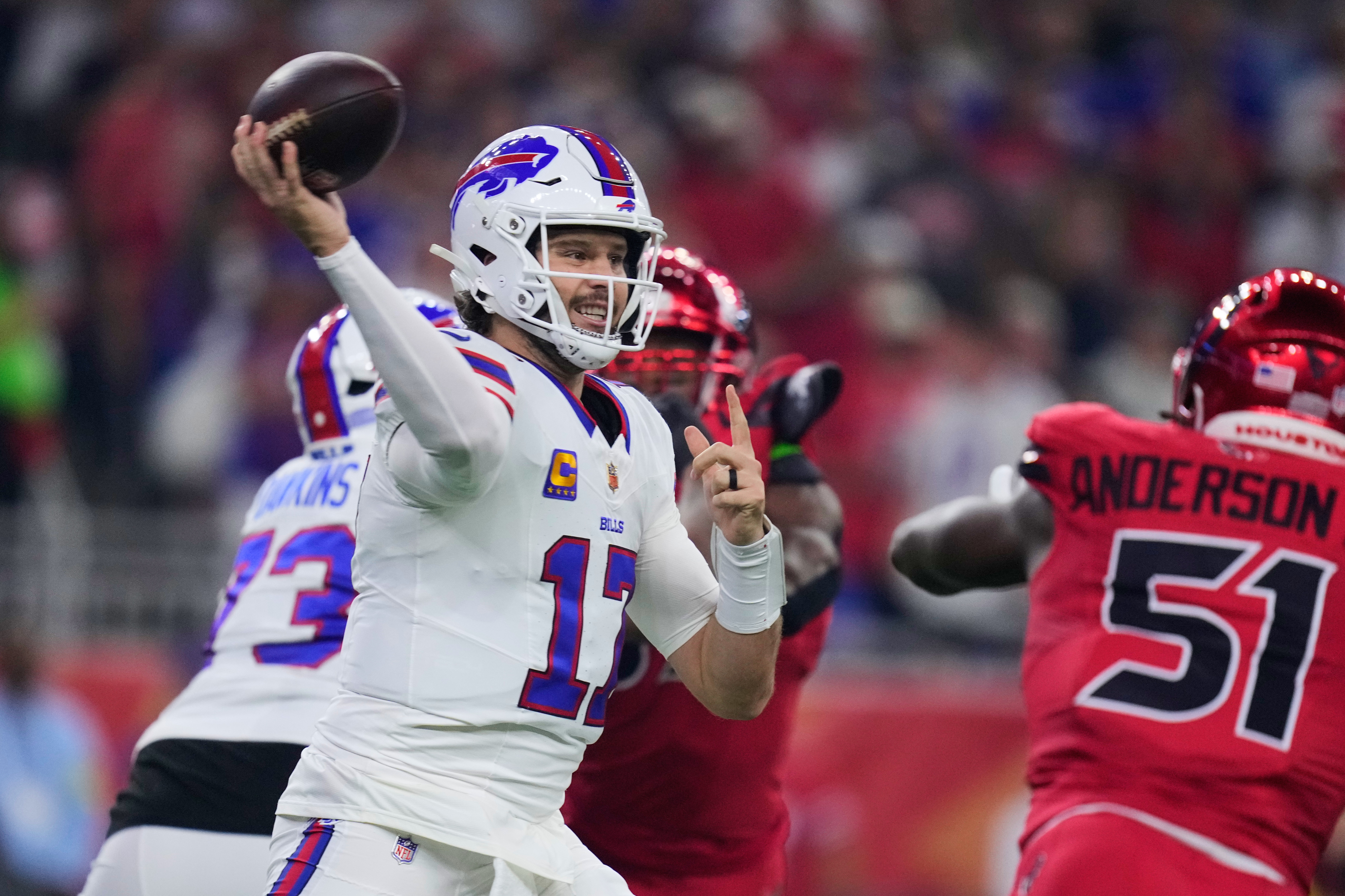 Buffalo Bills quarterback Josh Allen throws a pass under pressure from Houston Texans' Will Anderson Jr. (51) in the first half of an NFL football game Thursday, Nov. 20, 2025, in Houston. (AP Photo/Eric Christian Smith)