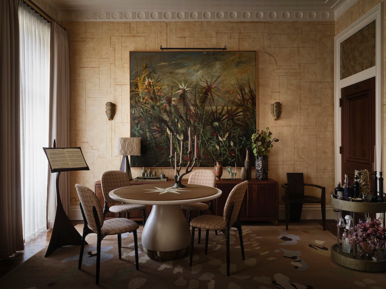 In "The River Room," Moore rejects the typical idea of a dimly lit smoking den for a light,...