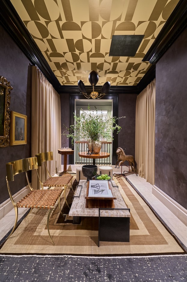 Dallas-based Joshua Bernard Design turned a hallway and bathroom into a striking space, with...