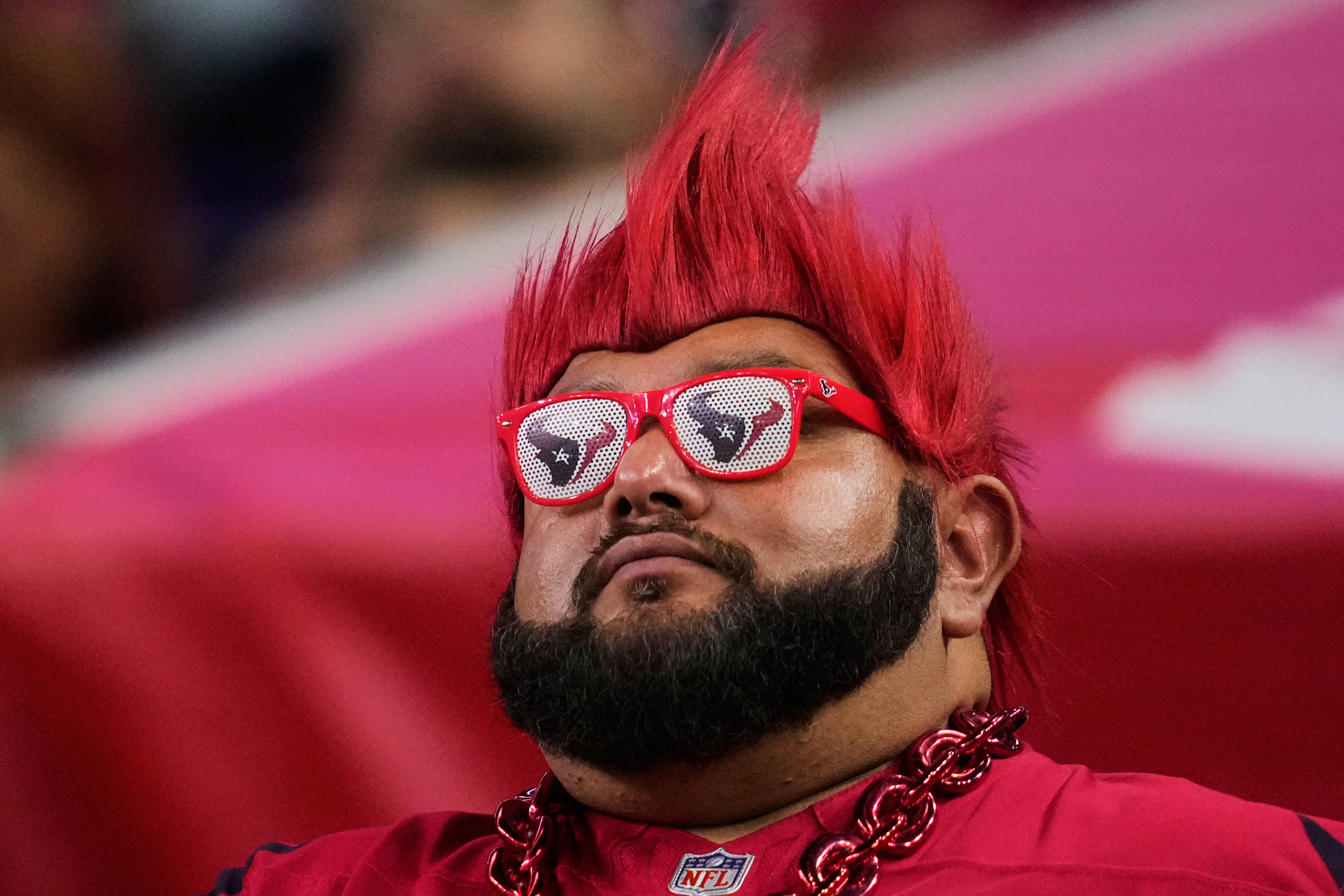 A Houston Texans fan watches play in the second half of an NFL football game against the Buffalo Bills Thursday, Nov. 20, 2025, in Houston. (AP Photo/Ashley Landis)