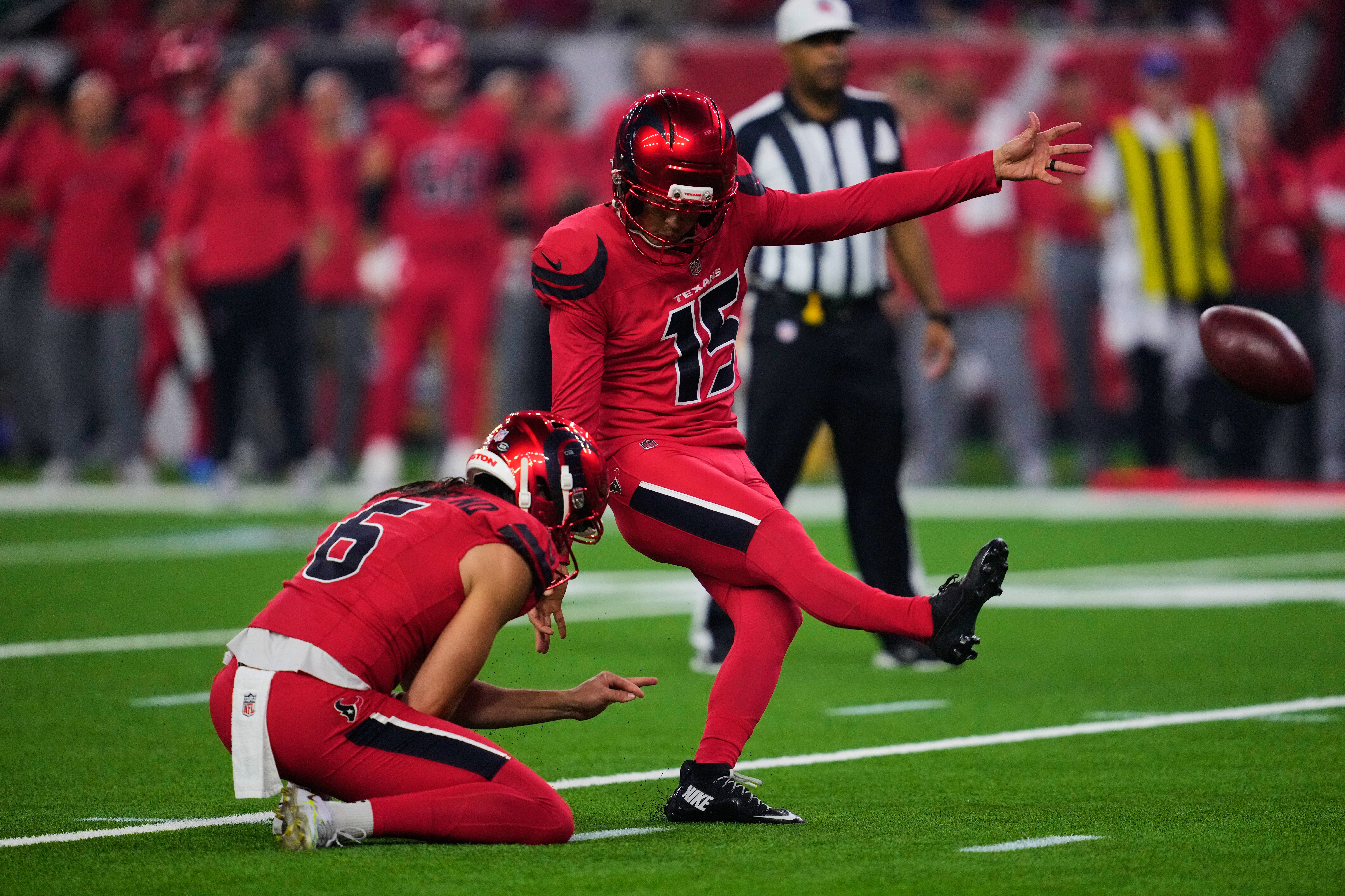 Houston Texans' Ka'imi Fairbairn (15) kicks a field goal as Tommy Townsend (6) holds in the first half of an NFL football game against the Buffalo Bills Thursday, Nov. 20, 2025, in Houston. (AP Photo/Ashley Landis)