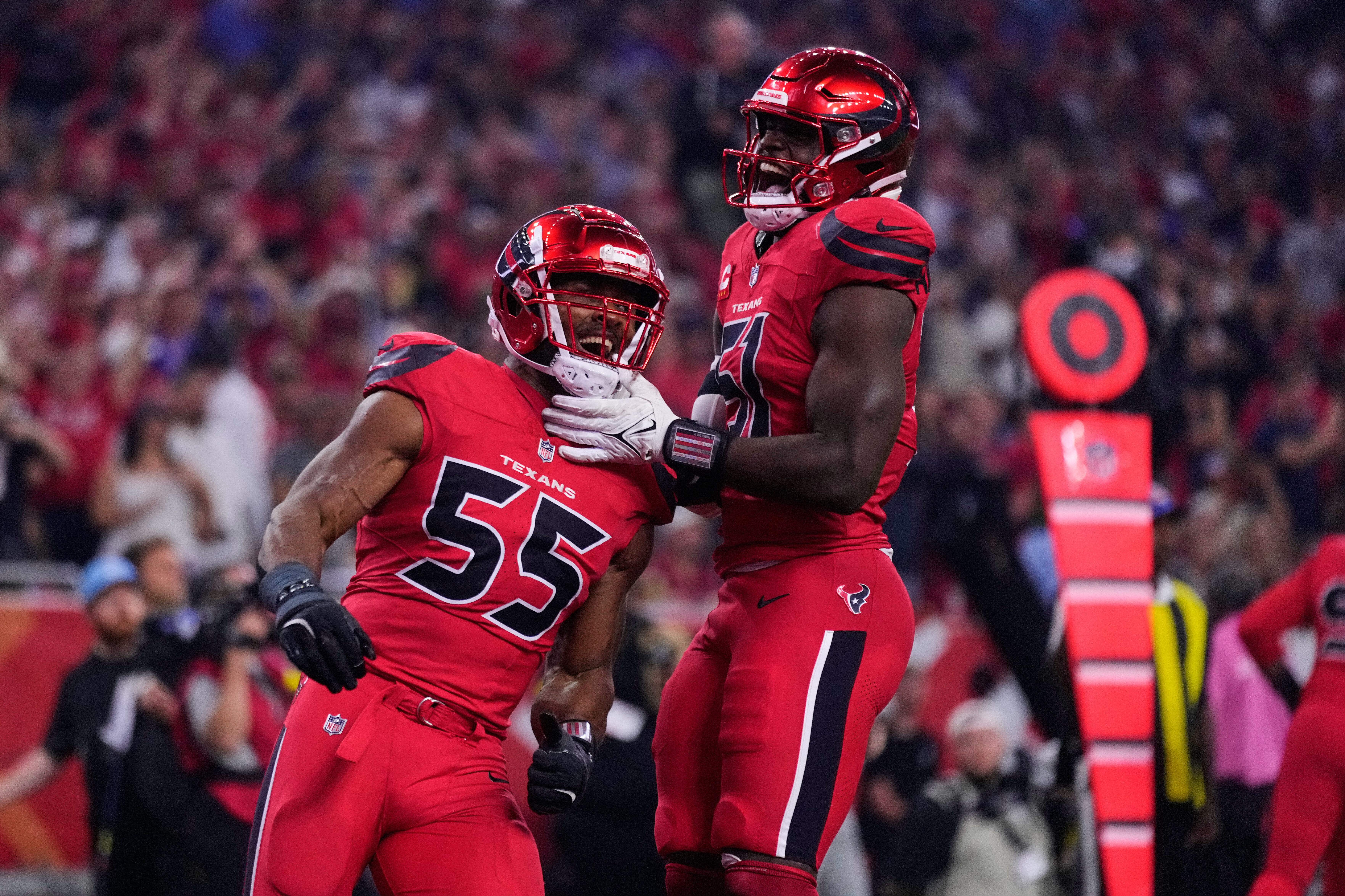 Houston Texans' Danielle Hunter (55) and Will Anderson Jr. (51) celebrate after sacking Buffalo Bills' Josh Allen in the second half of an NFL football game Thursday, Nov. 20, 2025, in Houston. (AP Photo/Eric Christian Smith)