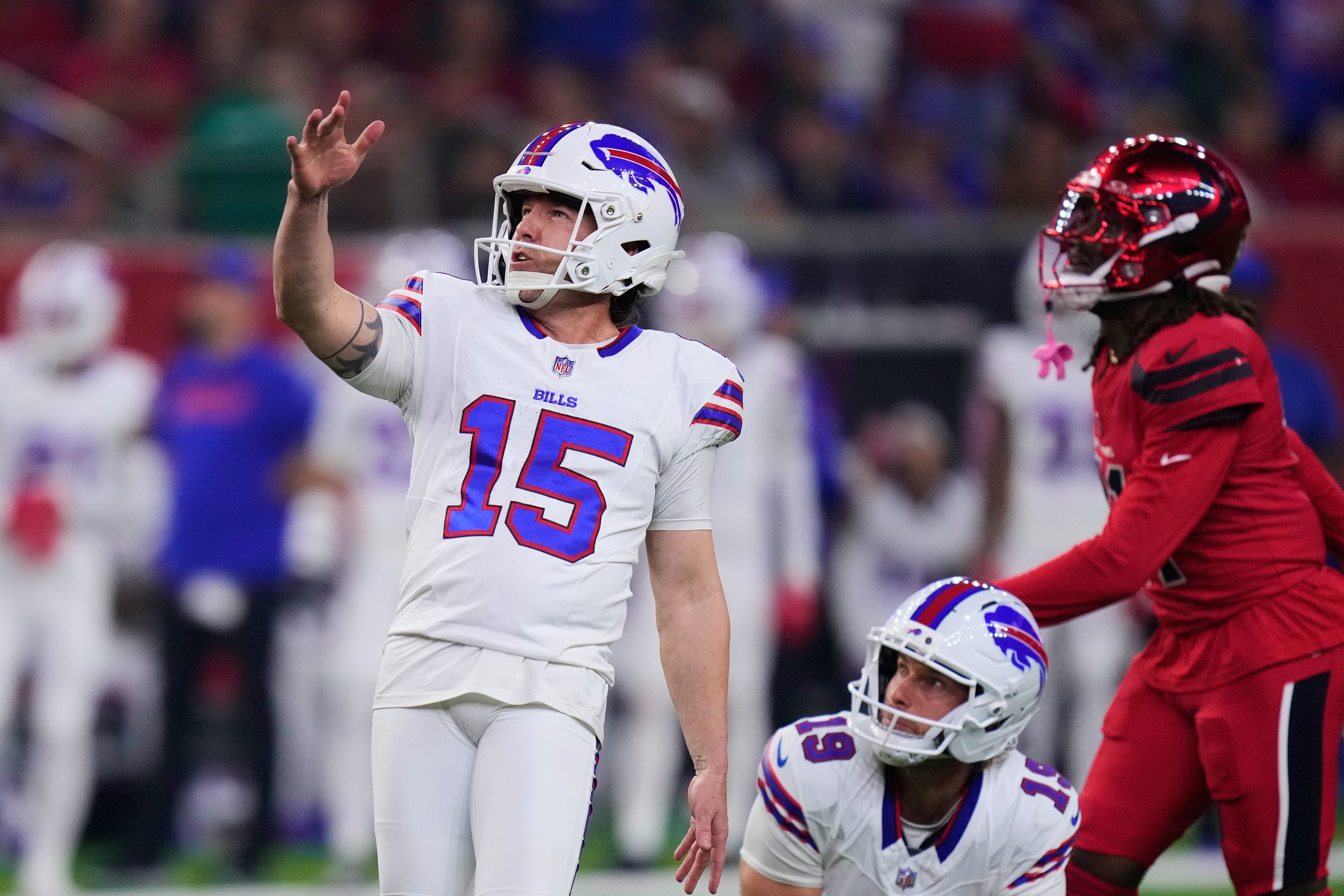 Buffalo Bills place kicker Matt Prater (15) kicks a field goal as Mitch Wishnowsky (19) holds in the first half of an NFL football game against the Houston Texans Thursday, Nov. 20, 2025, in Houston. (AP Photo/Eric Christian Smith)