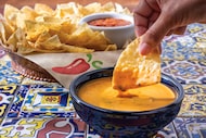 Chili's new Southwest Queso (pictured) is remaining on menus at the Dallas-born restaurant...