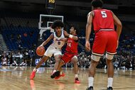 Duncanville’s Beckham Black (0) drives down the court during the first half of the...