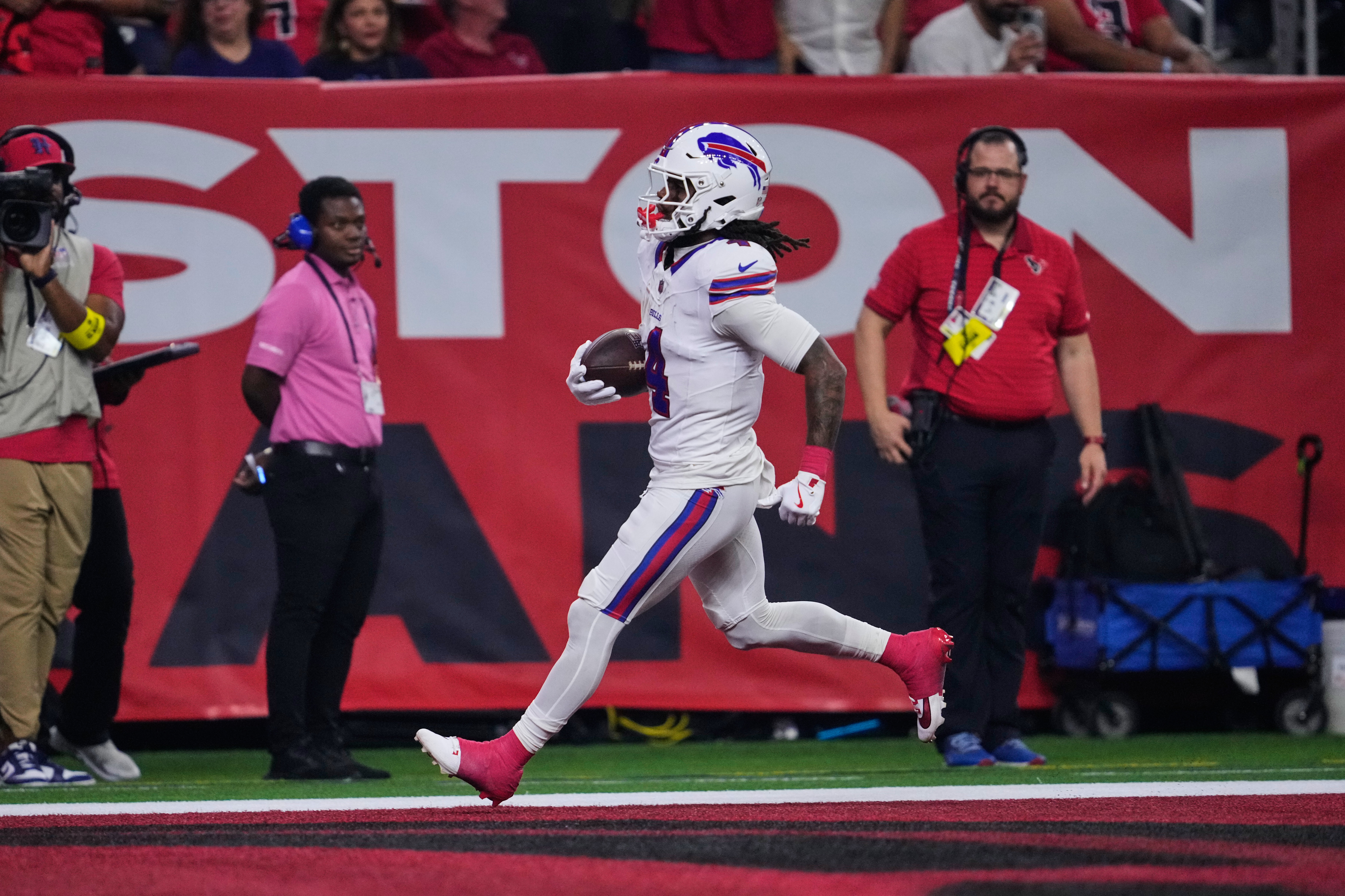 Buffalo Bills running back James Cook III (4) runs the ball for a touchdown in the first half of an NFL football game against the Houston Texans Thursday, Nov. 20, 2025, in Houston. (AP Photo/Ashley Landis)