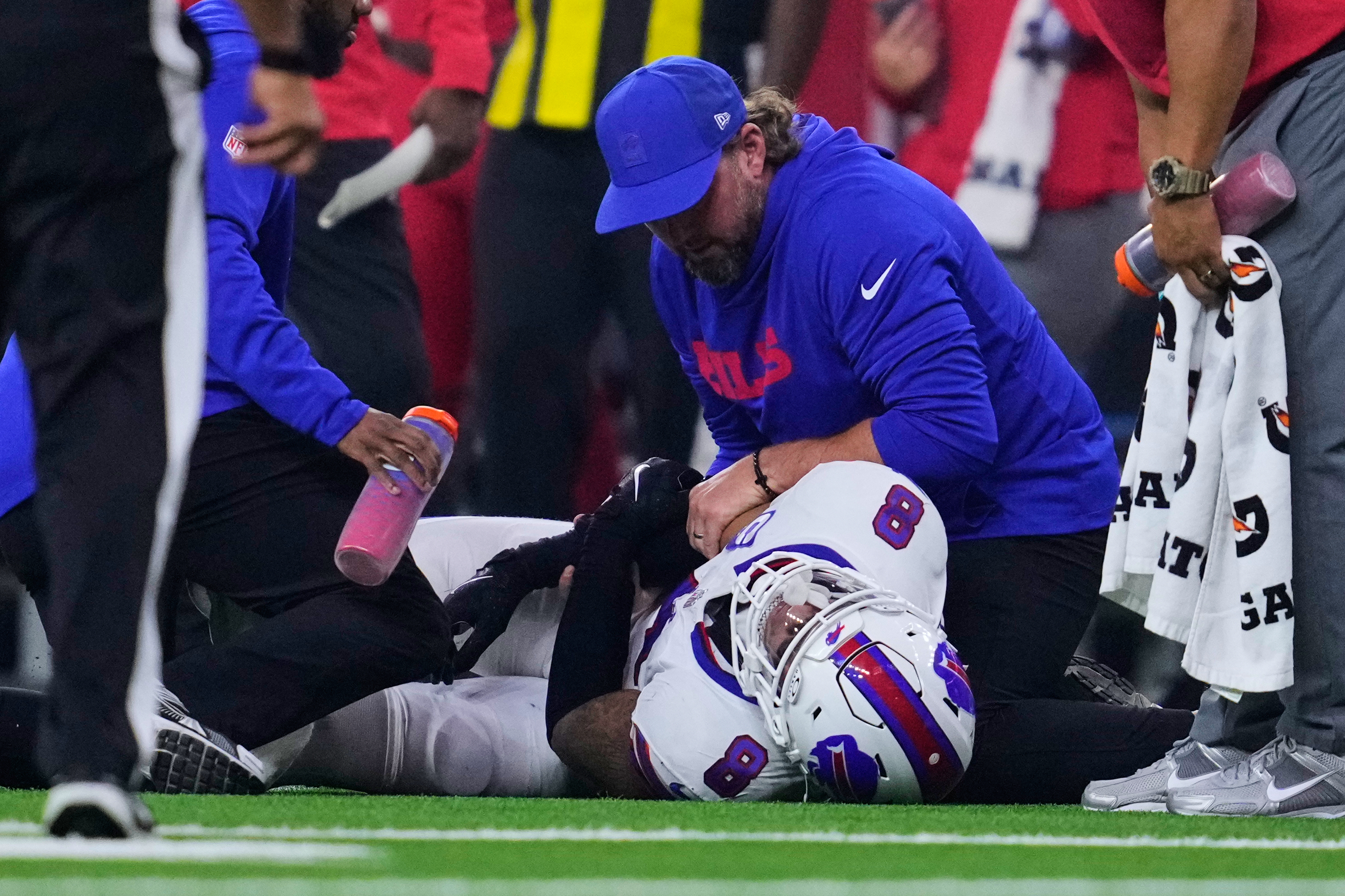 Buffalo Bills linebacker Terrel Bernard (8) is attended to by medical staff after suffering an unknown injury in the second half of an NFL football game against the Houston Texans Thursday, Nov. 20, 2025, in Houston. (AP Photo/Ashley Landis)