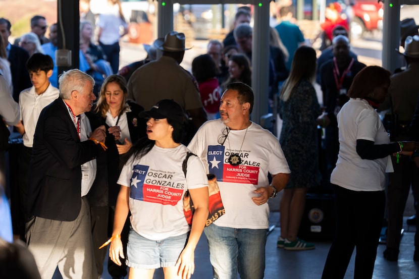 Supporters go through security ahead of a rally for Gov. Greg Abbott in Houston, Sunday,...