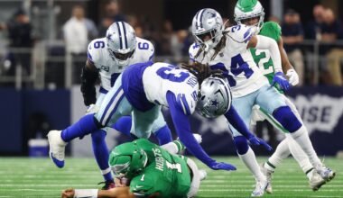 Nov 23, 2025; Arlington, Texas, USA; Philadelphia Eagles quarterback Jalen Hurts (1) slides with the ball in the third quarter against the Dallas Cowboys at AT&T Stadium.