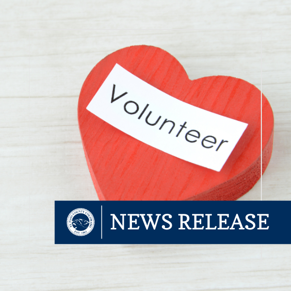 News Release graphic featuring a red heart with the word "Volunteer"