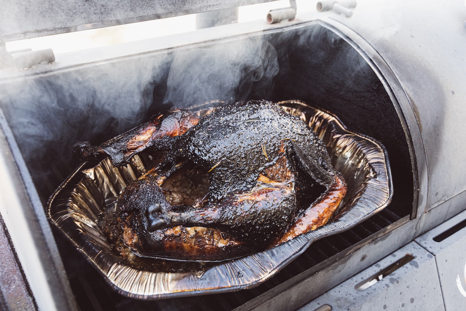 A burned chicken in a smoker.