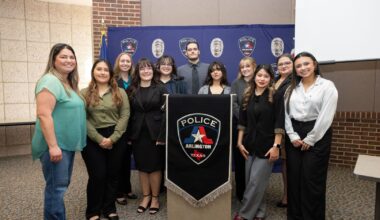 Students posed with Jessica Roberts, the daughter of Cynthia Gonzalez" style=" height:1020px; width:1620px" _languageinserted="true" src="https://cdn.prod.web.uta.edu/-/media/project/website/news/releases/2025/11/cold-case-1.jpg