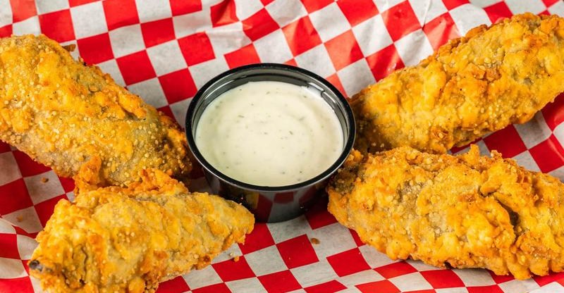 Lakewood Landing’s Bartenders are Famously Grumpy. Why Do We Keep Coming Back? The Jalapeño Corndog is Just One Reason