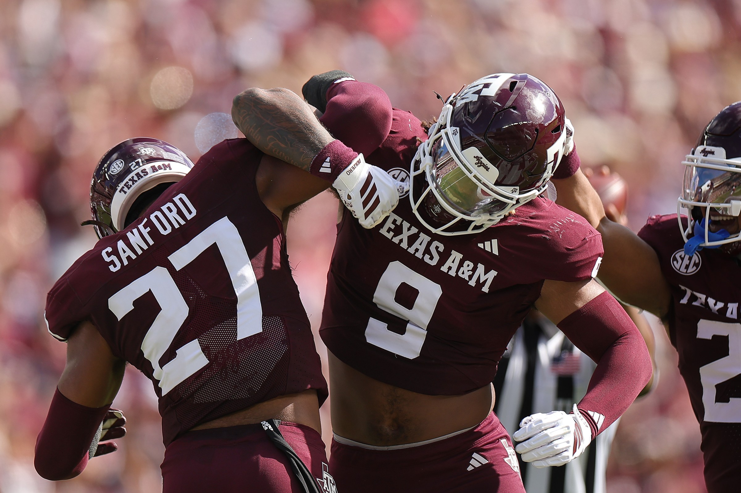 COLLEGE STATION, TEXAS - NOVEMBER 15: Cashius Howell #9 of the Texas A&M Aggies celebrates his deflected pass with teammate Daymion Sanford #27 of the Texas A&M Aggies against the South Carolina Gamecocks during the first quarter at Kyle Field on November 15, 2025 in College Station, Texas. (Photo by Alex Slitz/Getty Images)