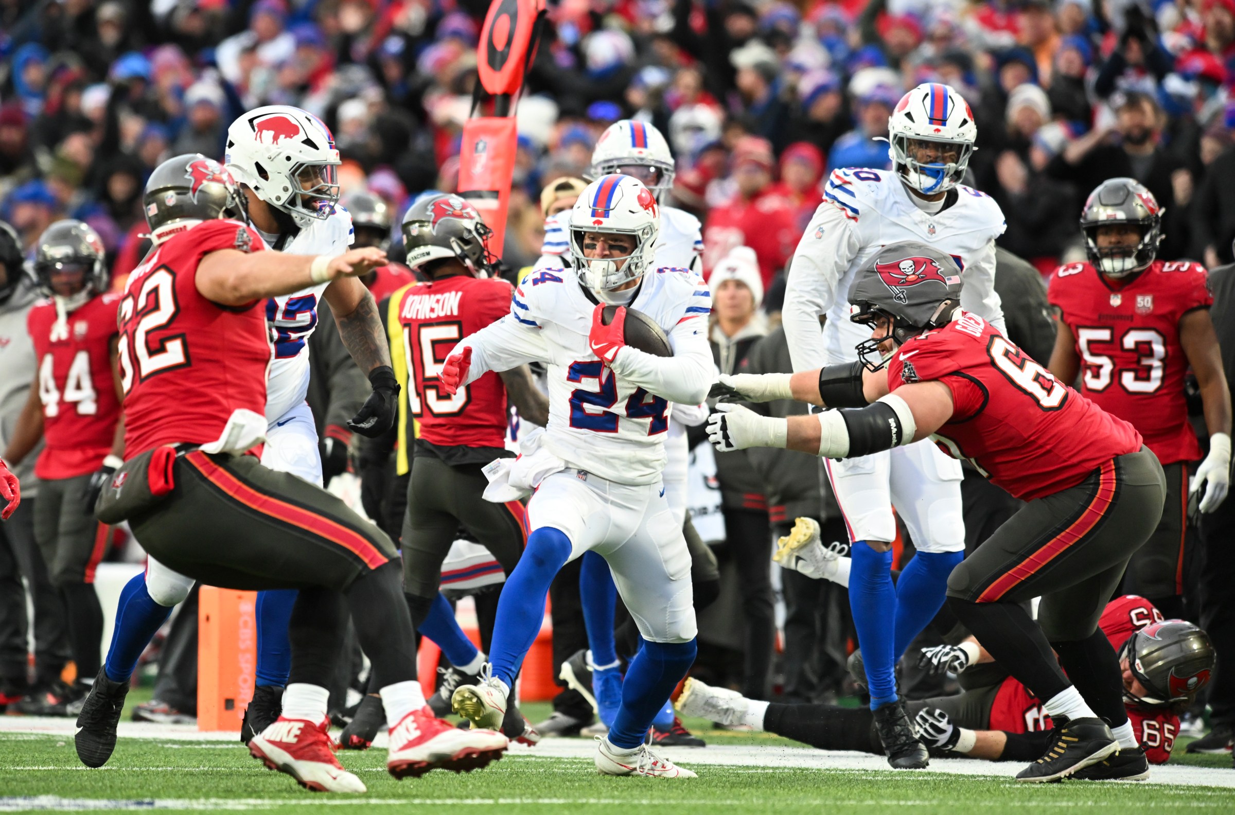 Nov 16, 2025; Orchard Park, New York, USA; Buffalo Bills safety Cole Bishop (24) makes an interception against the Tampa Bay Buccaneers during the third quarter of the game at Highmark Stadium. Mandatory Credit: Mark Konezny-Imagn Images