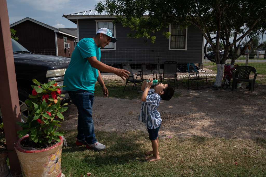 Jaime Galván, 48, plays with his three-year-old grandson Jaime Galván, III, at their home in Mercedes, Texas on April 23, 2025. Gabriel V. Cárdenas for The Texas Tribune
