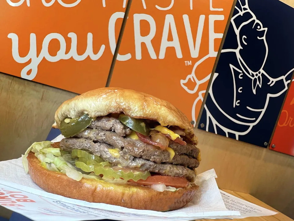 The Triple Boy from Burger Boy is a triple-meat burger with the option of adding cheese, jalapenos and bacon for an extra charge. (Mike Sutter/Staff)